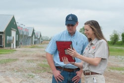 Angela Patton, a Tyson Foods Inc. service technician, works with Austin Butler, a contract chicken farmer. Photo courtesy of Tyson Foods Inc.