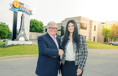 Réjean Nadeau, president and CEO, Olymel, and Mélissa Latifi, president and CEO, Triomphe Foods, commemorate Olymel’s agreement to acquire Triomphe with a handshake. | Photo courtesy of Olymel