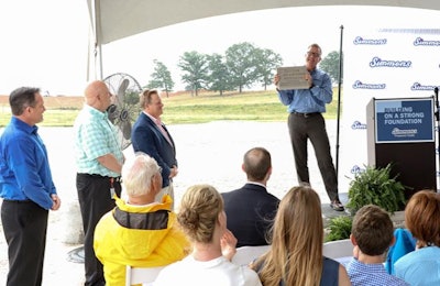 Todd Simmons, CEO and vice chairman of Simmons Foods, presents commemorative blocks to local dignitaries and the site dedication for Simmons' future poultry processing plant in Benton County, Arkansas. | Photo courtesy of Simmons Foods