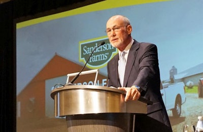 Lampkin Butts, president and chief operating officer of Sanderson Farms Inc., speaks at the 2018 Chicken Marketing Summit in Orlando, Florida. | Austin Alonzo