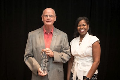Barbara Jenkins (right), USPOULTRY vice president of education and student programs and USPOULTRY Foundation executive director, presenting the Poultry Science Association Distinguished Poultry Industry Career Award to Dr. Greg Mathis, owner and operator of Southern Poultry Research, Inc. | Photo courtesy of USPOULTRY