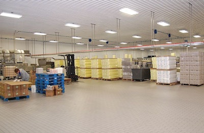 This clean packing room demonstrates a floor that looks clean and dry, without holes, cracks or depressions. | Terrence O'Keefe