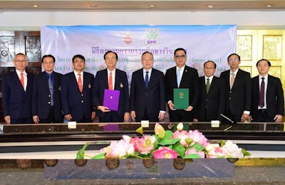 Officials from Walailak University and Charoen Pokphand Foods celebrate an academic cooperation agreement for a project to provide first-hand experience on modern farming business for students and local farmers. (CP Foods)