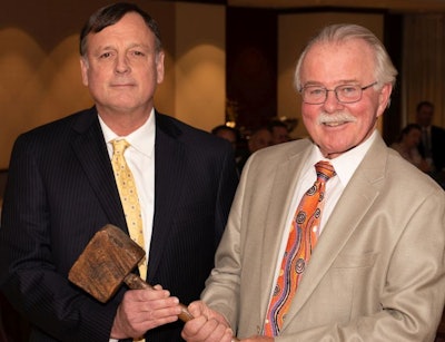 2019 chairman of U.S. Poultry & Egg Association, John Prestage (left), senior vice president of Prestage Farms, Clinton, N.C., was presented with the traditional “working man’s gavel” by outgoing chairman, Tom Hensley, president, Fieldale Farms. (USPOULTRY)