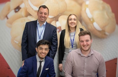 2 Sisters Food Group has launched a finance graduate program. Observing the new scheme are, top row from left, Financial Controller Dan Slater and Recruitment Lead Vicky Cowie, and, front row, Group Reporting Systems Accountant Arsalan Khan and Sam Phillips, finance graduate. (2 Sisters Food Group)