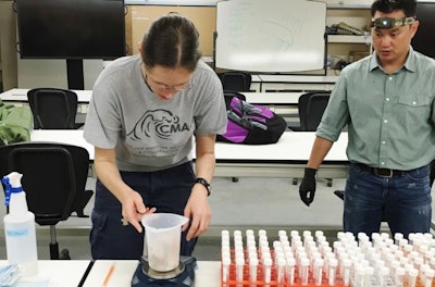 Dr. Charlotte Hieke and Dr. Hoa Nguyen-Phuc prepare for a circadian experiment, which is a 48-hour straight sampling experiment, where data is collected every six hours. (Dr. Giri Athrey | Texas A&M AgriLife Research)