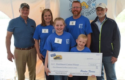 The Carpenter family from Wadesboro, N.C., were winners of Perdue Farms’ first Chicken Welfare Enrichment Design Contest. From left are Chairman Jim Perdue, Nicole Carpenter, Maddie Carpenter, Steve Carpenter, EB Carpenter, and Randy Day, CEO of Perdue Farms. (Perdue Farms)
