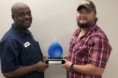 House of Raeford Farms' Steve Leachman, left, and Jimmy Adams receive the Louisiana Rural Water Association Private System of the Year award. (House of Raeford Farms)