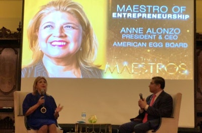 Anne Alonzo, president and CEO of the American Egg Board, visits onstage with Jorge Ferraez, publisher of Latino Leaders, during the Chicago Maestros award ceremony. (American Egg Board)