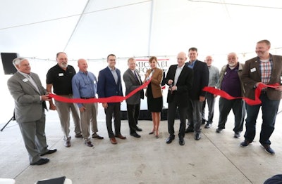 Michael Foods representatives, in the presence of state and local dignitaries, held a ribbon cutting ceremony to celebrate the opening of its new egg processing facility in Norwalk, Iowa. (Michael Foods)