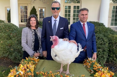 The National Turkey Federation presented Butter, the 2019 National Thanksgiving Turkey, to President Donald J. Trump and First Lady Melania Trump. Pictured are, center, NTF Chairman Kerry Doughty, his wife, Jan, left, and Wellie Jackson, right, the Butterball contract farmer who raised Butter. (National Turkey Federation)