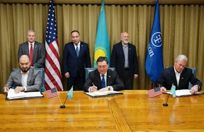 Tyson Foods, the Republic of Kazakhstan and private holding company Kusto Group signed an agreement at Tyson Foods World Headquarters in Springdale, Arkansas, to collaborate on a project that could lead to the construction of a modern beef processing plant in Kazakhstan. Signing from left to right are Yerkin Tatishev of Kusto Group, Kazakhstan Prime Minister Askar Mamin and Tyson Foods President and CEO Noel White. Behind them from left to right are Arkansas Lt. Governor Tim Griffin, Kazakhstan Ambassador to the U.S. Erzhan Kazykhaov and Tyson Foods Chairman John Tyson. (Tyson Foods)