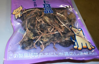 A bag containing unprocessed dead birds in cat food packaging was seized at a U.S. airport. The birds arrived on a flight from China. (U.S. Customs and Border Protection)