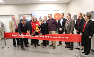 Iowa State University President Wendy Wintersteen and Arlene Hamilton cut the ribbon at the dedication ceremony of the Iowa State University Robert T. Hamilton Poultry Teaching and Research Farm on March 5. (Deven King)