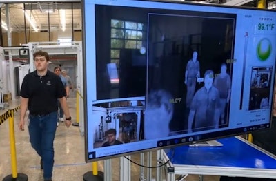 Tyson Foods workers walk through an infrared scanning device at a company facilities. The scanners are part of Tyson's efforts to protect the health of its workers amid the COVID-19 pandemic. (Tyson Foods)