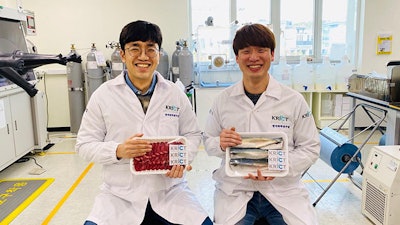 Dr. Dongyeop Oh and Dr. Sejin Choi from KRICT are holding sample groceries attached with stickers. (Korea Research Institute of Chemical Technology (KRICT))