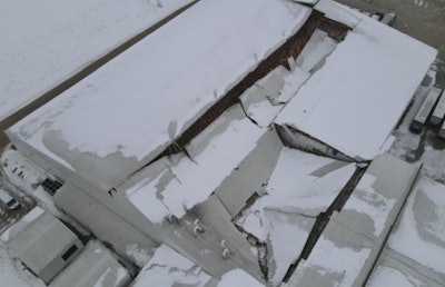 A roof on a layer barn in Palmyra, Wisconsin, partially collapsed on January 16. (Palmyra Public Safety Department | Facebook)