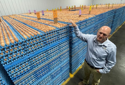 Farmers Hen House President Ryan Miller talks about the plant's daily egg output. (Photo by Jim Winter)