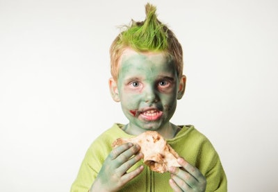 little boy dressed as a zombie on halloween