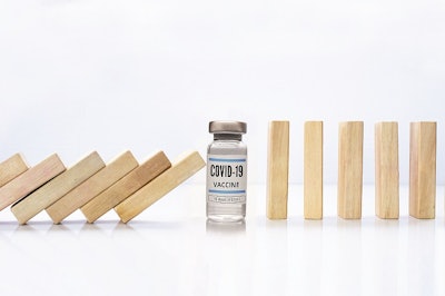 Wooden Pieces Domino Effect Stopping Fall With A Covid-19 Vial Vaccine, Next To Stand Wooden Pieces