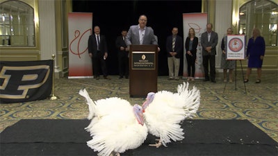 Peanut Butter and Jelly, the 2021 presidential turkeys, were introduced in the nation’s capital on November 18. Pictured in the background is NTF Chairman Phil Seger. (YouTube)