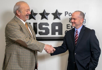 Jim Sumner, left, congratulates Greg Tyler, who has been chosen to succeed Sumner as the president and CEO of the USA Poultry & Egg Export Council. (Courtesy USAPEEC)