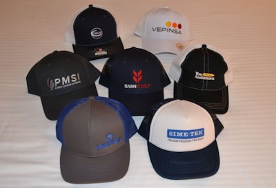 This is a sampling of baseball caps offered at the booths of exhibitors at International Production & Processing Expo 2022. (Roy Graber)