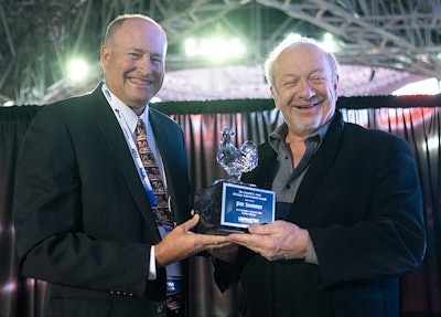 Jim Sumner, president & CEO of the USA Poultry & Egg Export Council (left), was honored by U.S. Poultry & Egg Association with the Harold E. Ford Lifetime Achievement Award at the 2022 IPPE. He was presented with the award by Greg Hinton (left), vice president of sales at Rose Acre Farms, outgoing USPOULTRY chairman, and USAPEEC board member. (USPOULTRY)