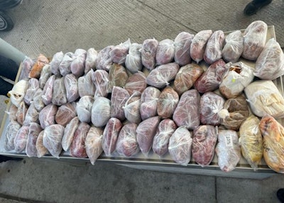 Packages containing 124 pounds of prohibited fresh pork and poultry meat seized by CBP officers, agriculture specialists at Laredo Port of Entry's Juarez-Lincoln Bridge. (Courtesy U.S. Customs and Border Protection)