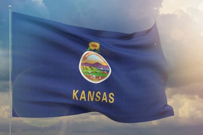 Flags of the states of USA. State of Kansas flag. Waving flag on sunset sky background 3D illustration.