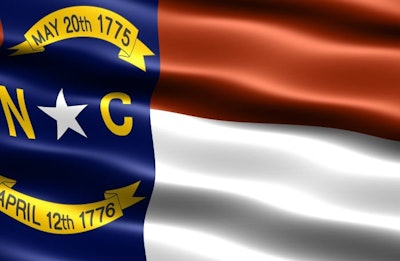 Computer generated illustration of the flag of the state of North Carolina with silky appearance and waves