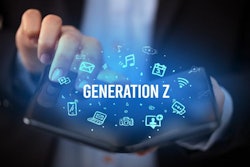 Businessman holding a foldable smartphone with GENERATION Z inscription, social media concept