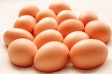A group of Brown hens eggs on a white background