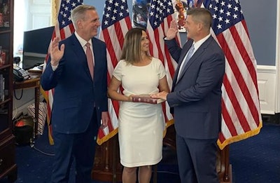 Brad Finstad, left, is shown being sworn into office in the United States House of Representatives in August after winning a special election. (Courtesy Finstad campaign)