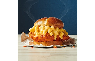 Buffalo Mac Chicken Sandwich from Chester...s Chicken, featuring Chester...s signature fried chicken tossed in buffalo sauce, topped with a generous scoop of mac & cheese and a slice of white American cheese, and served on a brioche bun. Available now through Jan. 17, 2023.
