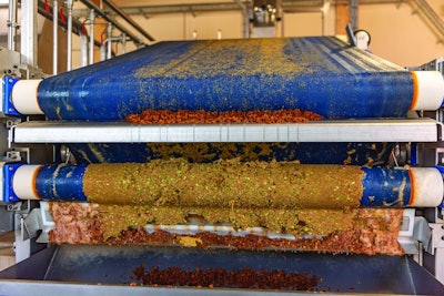 Machine squeezes apples and apple pomace remain as press residues