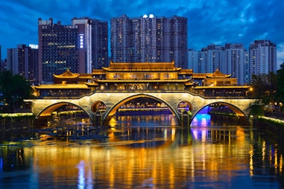 Famous landmark of Chengdue - Anshun bridge over Jin River illuminated at night, Chengdue, Sichuan , China