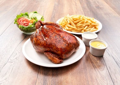 Peruvian grilled chicken with French fries and salad – a national dish.