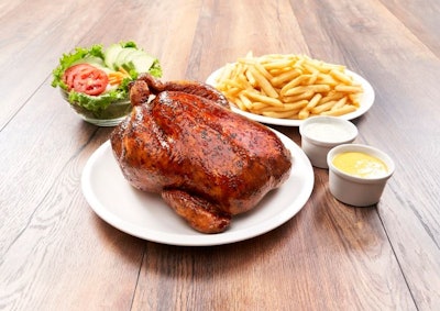 Peruvian grilled chicken with French fries and salad – a national dish.
