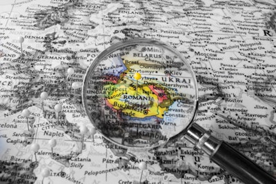 Romania Atlas With Magnifying Glass