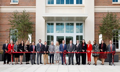 Gov. Brian Kemp and UGA President Jere W. Morehead,. middle, are joined by university and state dignitaries for the ribbon cutting of the Poultry Science Building.