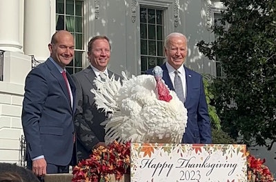 Jose Rojas, assistant vice president of live production at Jennie-O Turkey Store; Steve Lykken, president of Jennie-O Turkey Store; and U.S. President Joe Biden pose with Liberty, the 2023 National Thanksgiving Turkey.