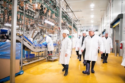 Ontario Premier Doug Ford, front left, tours the Maple Leaf Foods poultry plant in London, Ontario.