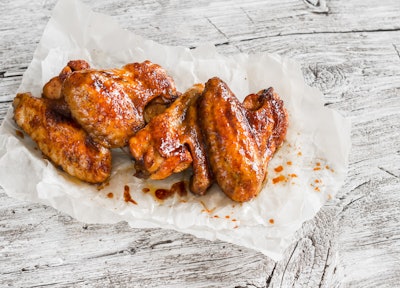 Baked Chicken Wings On Wooden Table