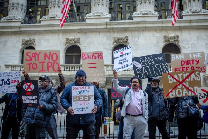 Members of the advocacy group Ban the Batistas protest outside of the New York Stock Exchange office on April 26, the same date JBS shareholders elected brothers Wesley and Joesley Batista to the board.