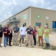 Von Miller joins staff members from Greener Pastures Chicken and Texas A&M University for the opening of the Greener Pastures Chicken plant in Elgin, Texas.