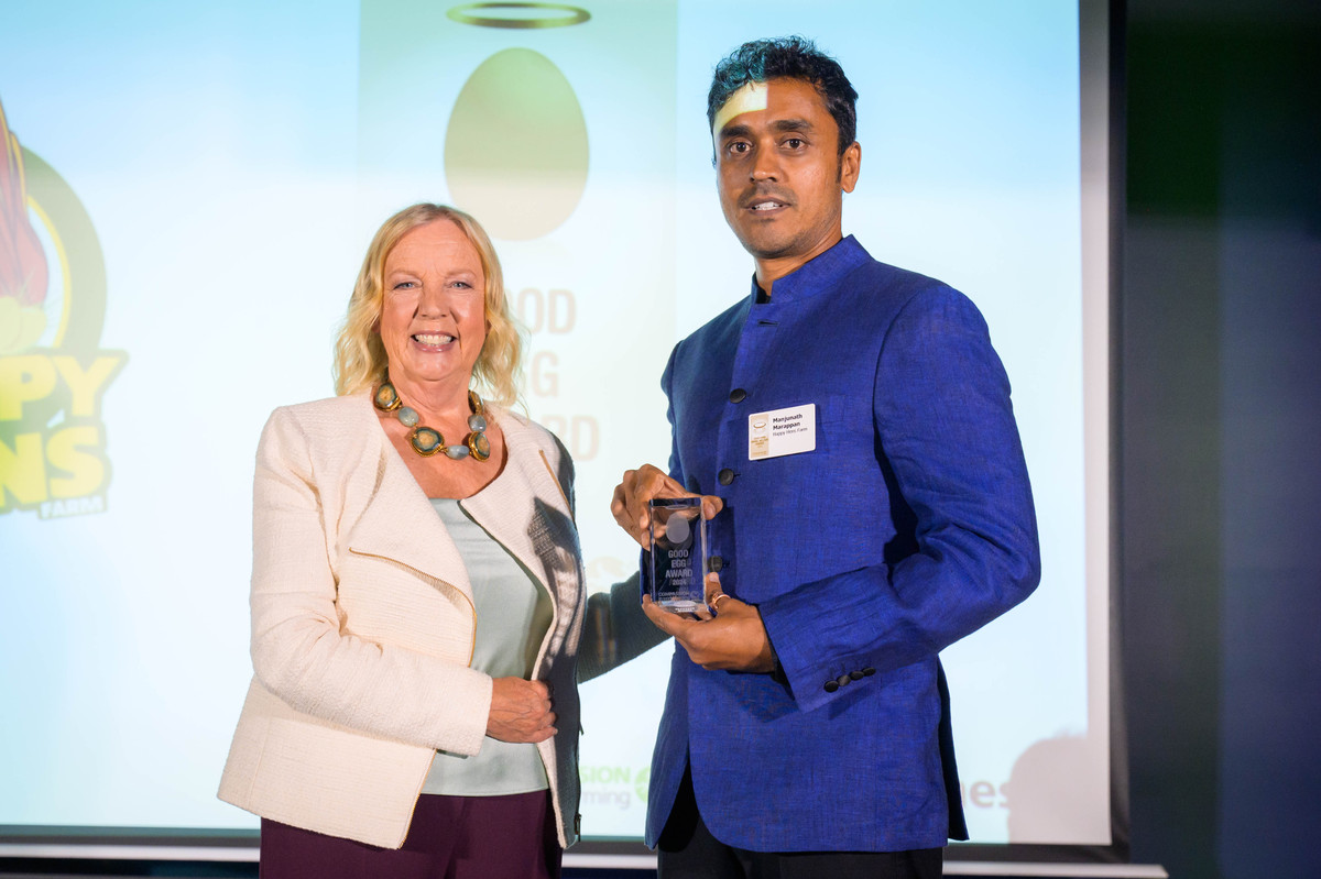 CIWF Patron, businessperson and TV personality Deborah Meaden (left) presents Manjunath Marappan, Founder Director CEO of Happy Hens, with the Good Egg Award.