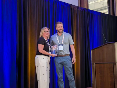 Jody Hallman, VP, integrated marketing, Perdue Foods, accepts the 2025 Chicken Marketer of the Year award.